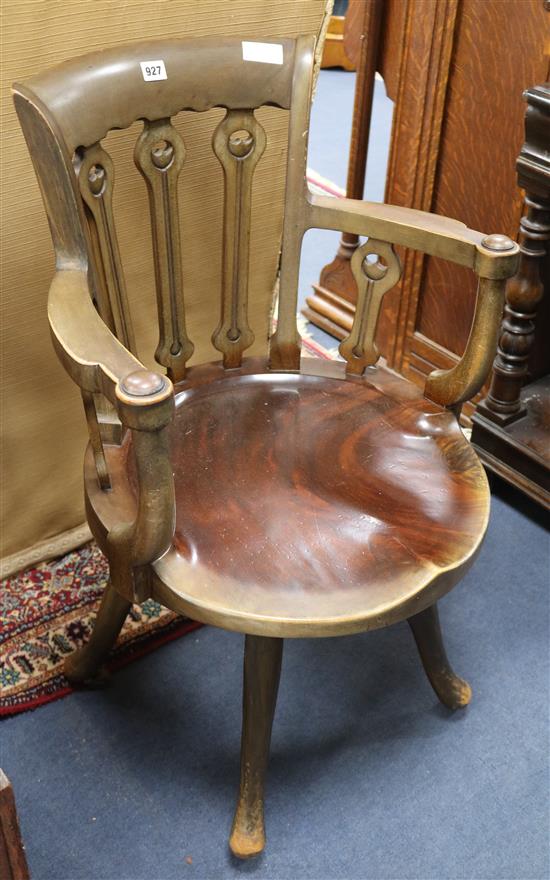 An Edwardian walnut desk chair